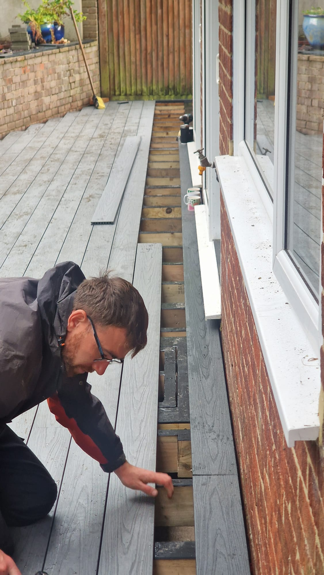 Aaron, ARC Sussex Carpentry carpenter working on a bespoke decking project