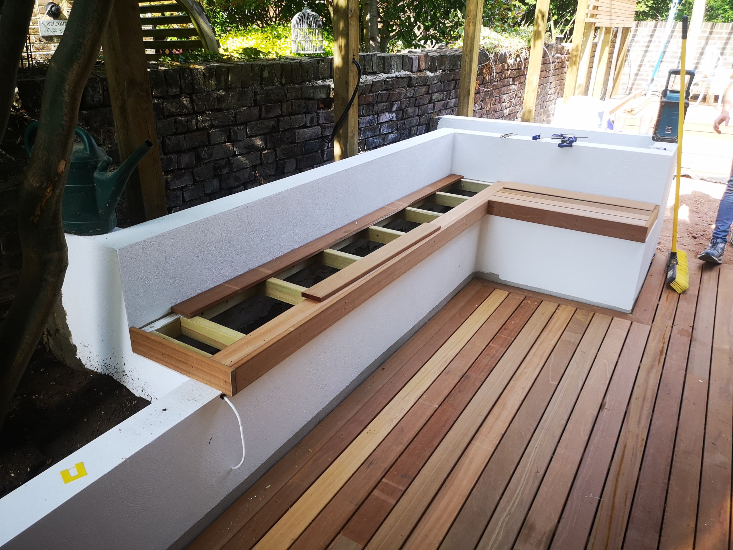 Garden decking and bespoke seating built by ARC Sussex Carpentry in Brighton